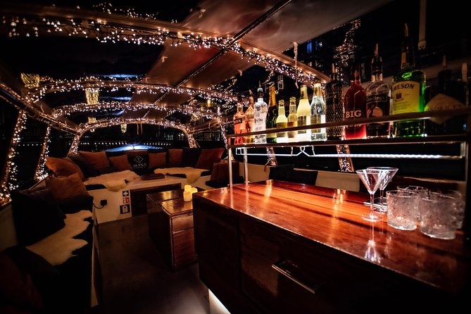 Amsterdam 2-Hour Evening Cruise With Live Guide and Bar - Skinny Bridge and the Amstel after dark