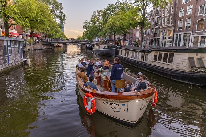 Amsterdam 2 Hour Small-Group Canal Cruise with Dutch Snacks & Bar - Rijksmuseum, NEMO, and Central Station