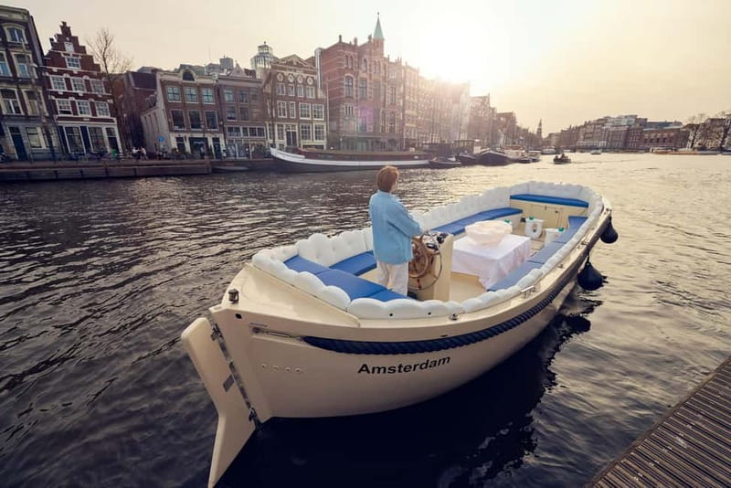 Amsterdam: Smoke & Cruise on covered Cannabis Boat With Bar - Fifteen minutes through Amsterdam’s canals