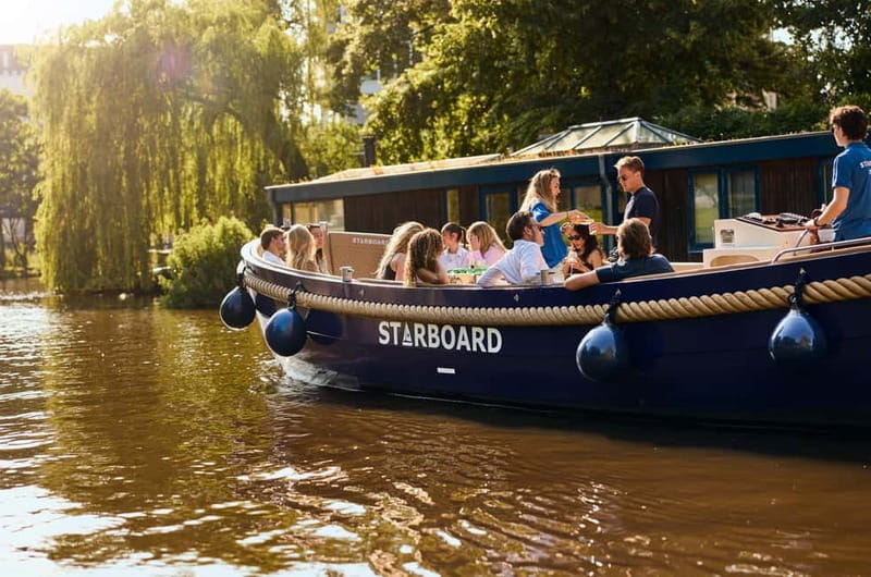 Amsterdam: Spanish Guided Open Boat Cruise with Bar Onboard - The Electric Open Boat Experience