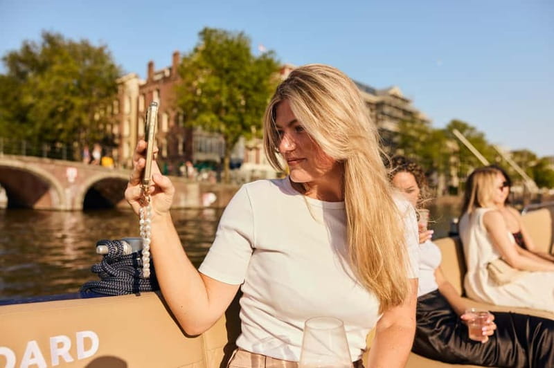 Amsterdam: Spanish Guided Open Boat Cruise with Bar Onboard - Spanish Commentary and Guide Quality