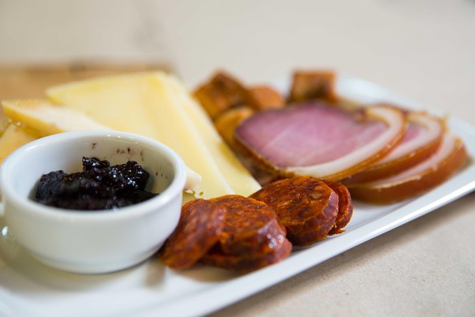 Budapest Wine Bar Tour with Sausage and Cheese Charcuterie - Local snacks make the tastings more satisfying