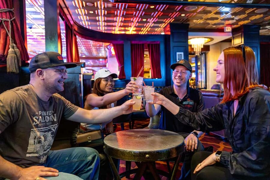 Las Vegas: Fremont Cocktail Crawl & Guided Walking Tour - Reading Fremont Street through neon and casinos