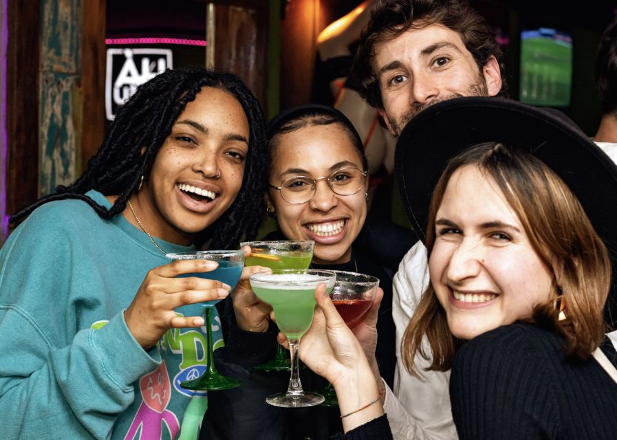 Lisbon: Tipsy Tour Fun Bar Crawl with a Local Guide - Bairro Alto after dark: a neighborhood built for wandering