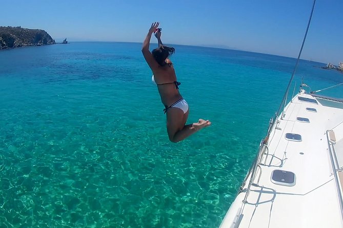 Mykonos Catamaran Private Sunset Cruise, Full Meal & Open-Bar - Rhenia’s quiet coves and the first swim