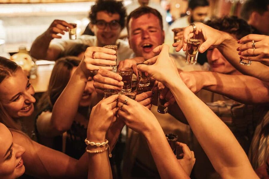 Rome: Nightlife Tour & Guided Bar Crawl with Games & Karaoke - Walking through Rione Monti after sunset