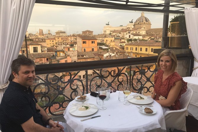 Rooftops of Rome by Night Food Tour with Dinner, Cocktails & Guided Sightseeing - First rooftop: a view toward the Trevi Fountain