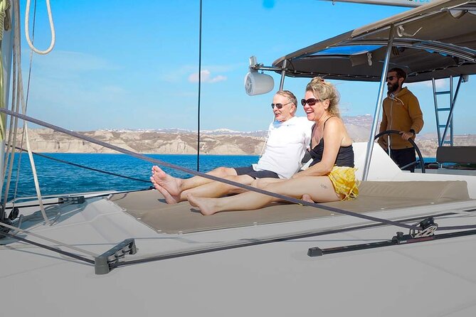 Santorini Catamaran Cruise with Greek Meal, Open-Bar and Sunset - Red Beach and the southern shoreline