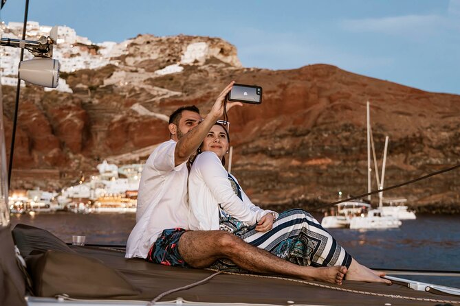 Santorini Catamaran Cruise with Greek Meal, Open-Bar and Sunset - Sunset from the catamaran