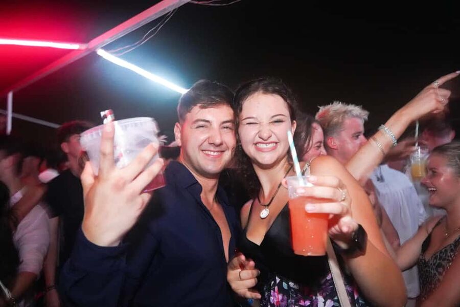 Split: Boat Crawl with Nightclub Access, Shots, & Boat Party - The night boat with two bars and a live DJ