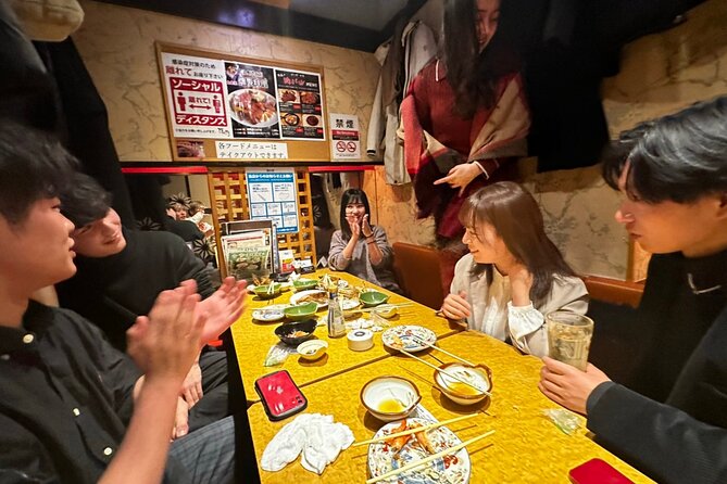 Tokyo: Private Shibuya Bar Crawl Tour -3 Drinks & Local Foods- - A pause at Shibuya Crossing