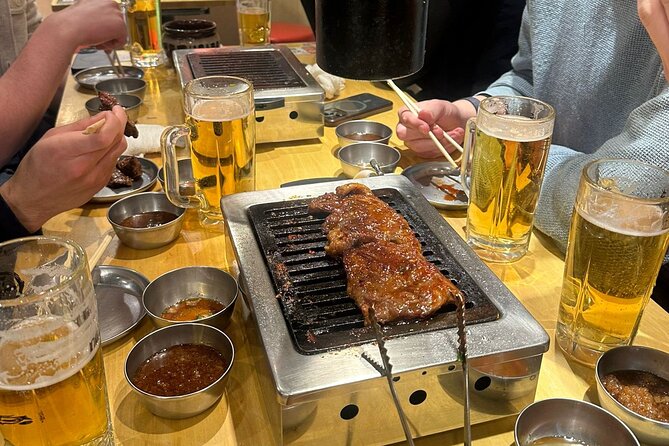 Tokyo: Shinjuku Bar Hopping & Night Walking Tour - Omoide Yokocho: lanterns, smoke, and tiny counters