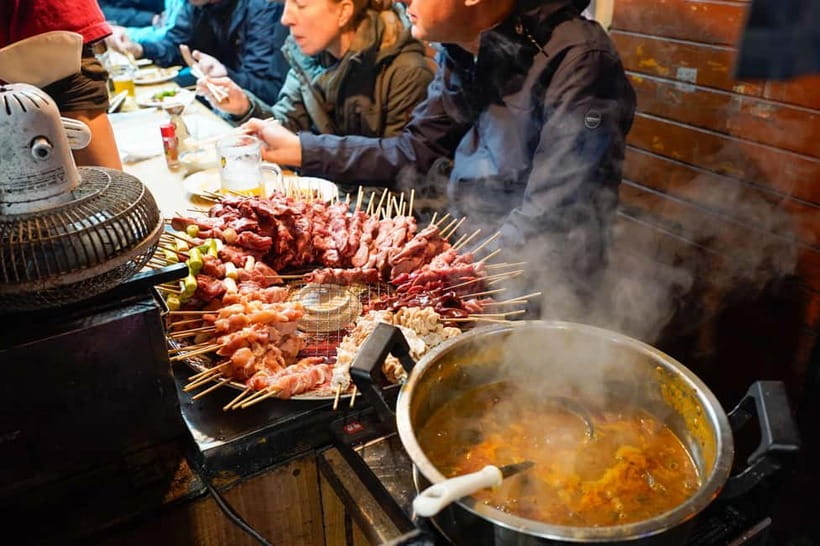 Tokyo: Shinjuku Golden Gai Bar Hopping Night Tour - Walking through Kabukicho after dark