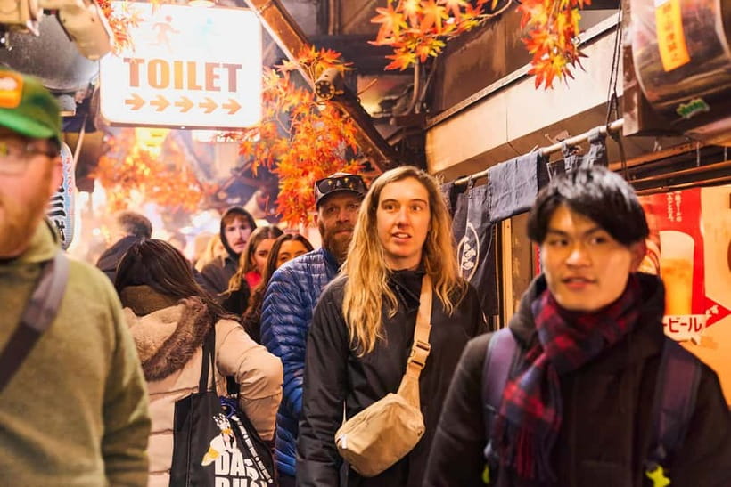 Tokyo: Shinjuku Nightlife & Secret Backstreets Walking Tour - Meeting beneath the Shinjuku neon