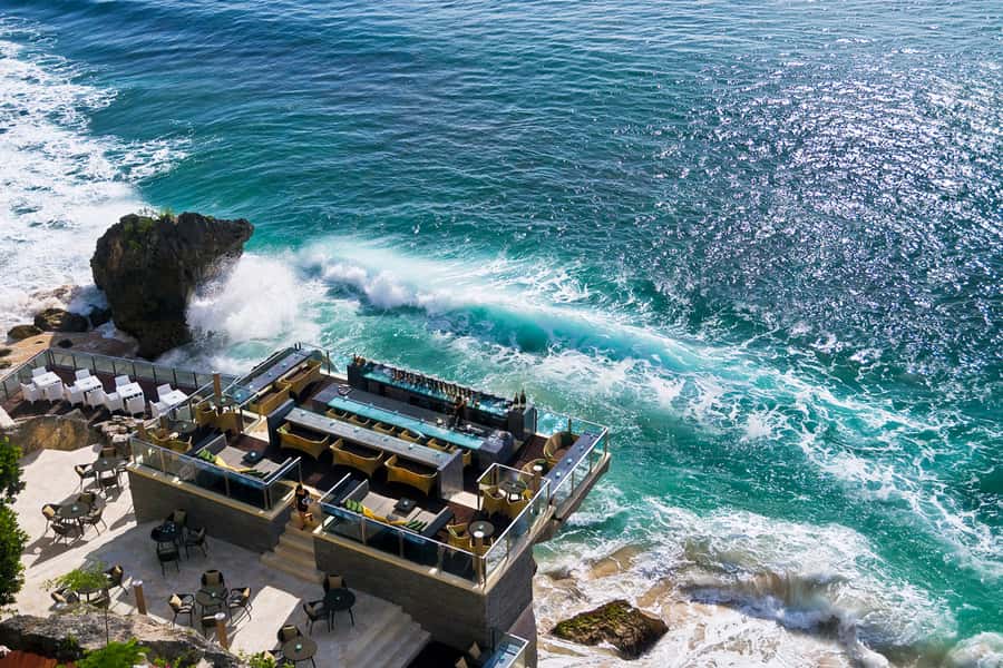 Uluwatu: Beach Club and Cliffside Private Bar Hopping Tour - Jimbaran Bay after dark